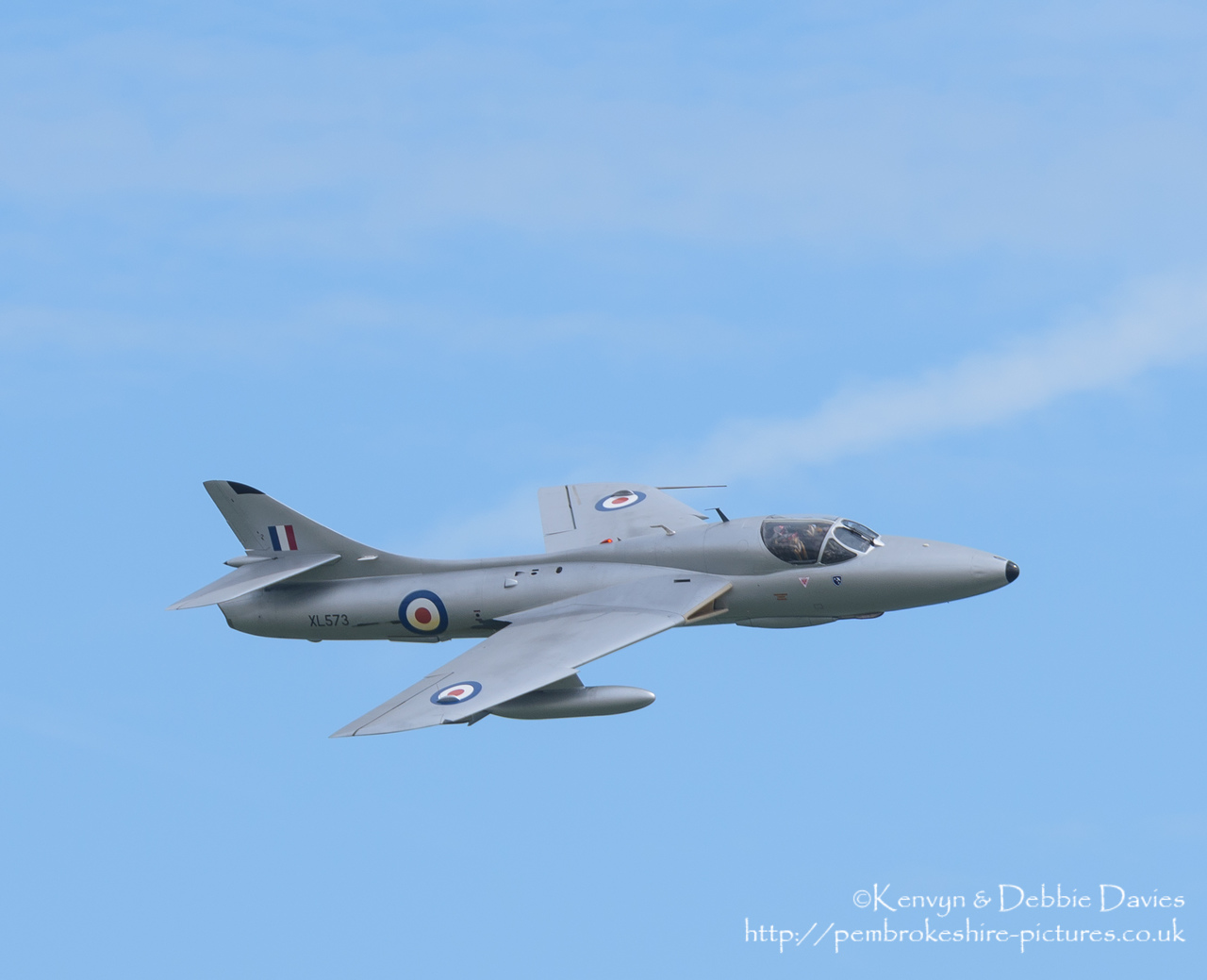 XL573 was originally delivered to the RAF in July 1958 to become part of the Day Fighter Leaders School at RAF West Raynham. She also served with the Air Fighting Development School (AFDS) and also the Day Fighter Conversion Squadron (DFCS). <br/><br/>After moving to various (generally training schools) XL573 was retired and sold off in 1991.<br/><br/>Although having passed through several owners since, XL573 has fairly consistently appeared in air shows around the country.