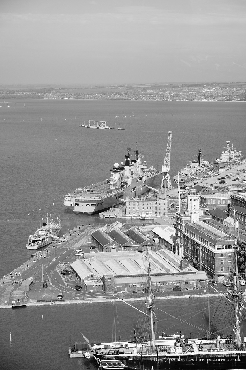 HMS Illustrious is an "Invincible" class light aircraft carrier, the middle of three built for the Royal Navy in the late 70s and early 80s (she was commissioned in 1982). Following the retirement of the Harrier VTOL aircraft in 2010 she became and helicopter carrier and is the oldest (as of 2014) serving ship in the Royal Navy. We were lucky to see her before her final deployment following which she will be de-commissioned and preserved for the nation.