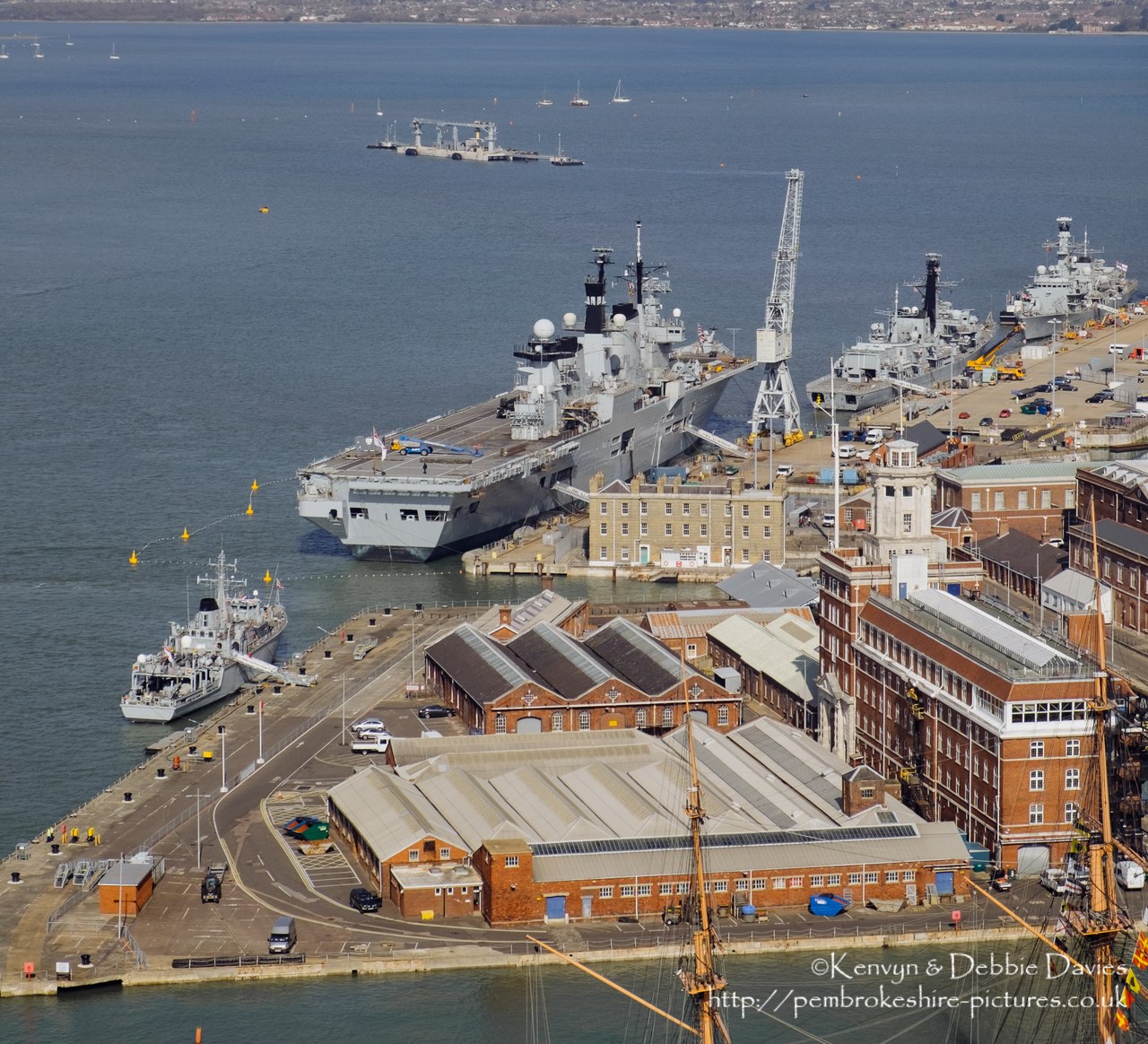 HMS Illustrious is an "Invincible" class light aircraft carrier, the middle of three built for the Royal Navy in the late 70s and early 80s (she was commissioned in 1982). Following the retirement of the Harrier VTOL aircraft in 2010 she became and helicopter carrier and is the oldest (as of 2014) serving ship in the Royal Navy. We were lucky to see her before her final deployment following which she will be de-commissioned and preserved for the nation.
