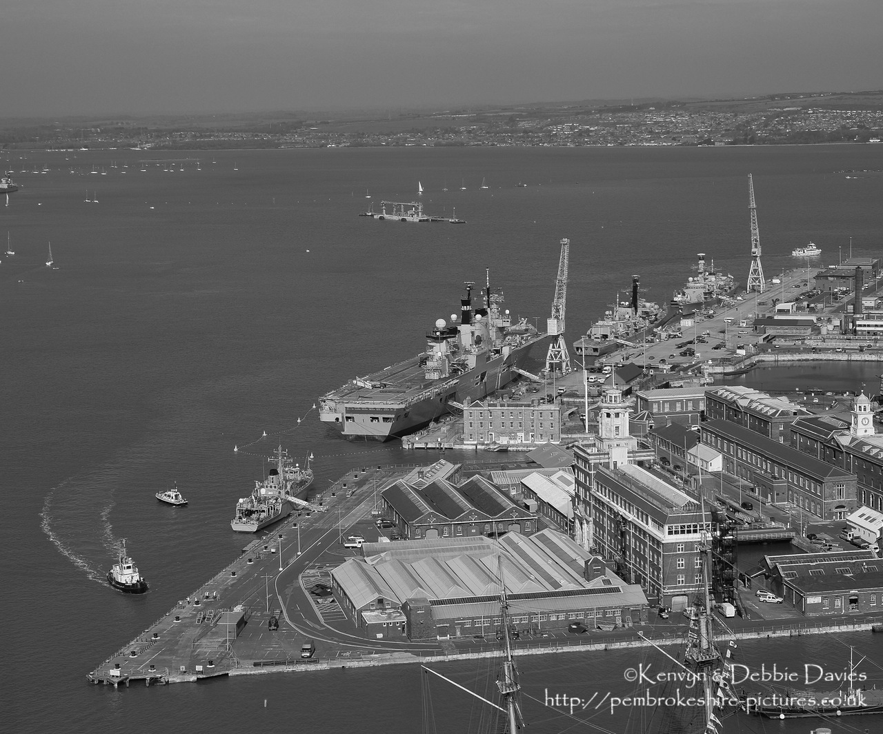 HMS Illustrious is an "Invincible" class light aircraft carrier, the middle of three built for the Royal Navy in the late 70s and early 80s (she was commissioned in 1982). Following the retirement of the Harrier VTOL aircraft in 2010 she became and helicopter carrier and is the oldest (as of 2014) serving ship in the Royal Navy. We were lucky to see her before her final deployment following which she will be de-commissioned and preserved for the nation.