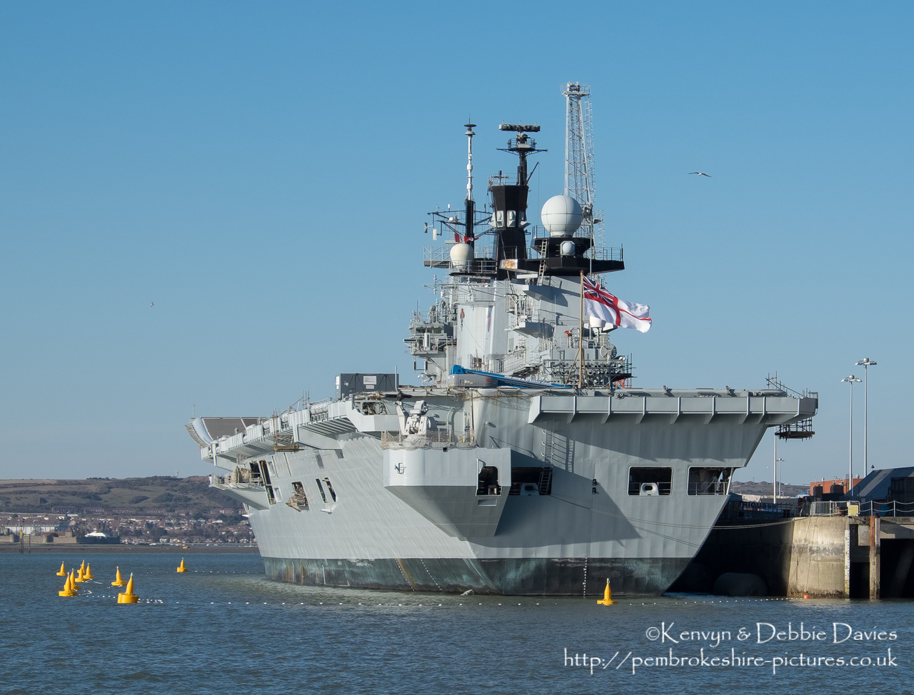HMS Illustrious is an "Invincible" class light aircraft carrier, the middle of three built for the Royal Navy in the late 70s and early 80s (she was commissioned in 1982). Following the retirement of the Harrier VTOL aircraft in 2010 she became and helicopter carrier and is the oldest (as of 2014) serving ship in the Royal Navy. We were lucky to see her before her final deployment following which she will be de-commissioned and preserved for the nation.