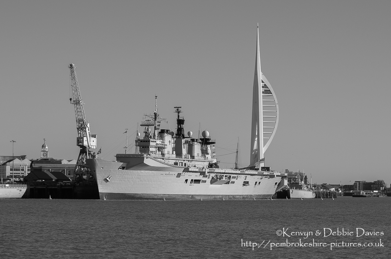 HMS Illustrious is an "Invincible" class light aircraft carrier, the middle of three built for the Royal Navy in the late 70s and early 80s (she was commissioned in 1982). Following the retirement of the Harrier VTOL aircraft in 2010 she became and helicopter carrier and is the oldest (as of 2014) serving ship in the Royal Navy. We were lucky to see her before her final deployment following which she will be de-commissioned and preserved for the nation.