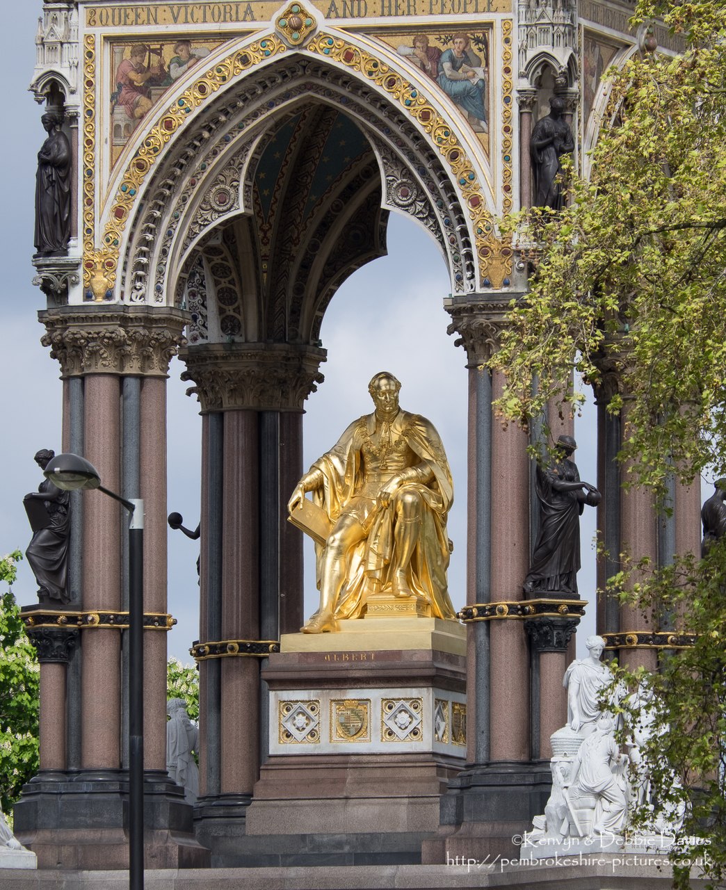 Officially the Prince Consort National Memorial.<br/><br/>Located in Kensington Gardens on Albert Memorial Road opposite the Royal Albert Hall.<br/><br/>Albert is shown holding the catalogue of the Great Exhibition of 1851, which he inspired and helped organise.