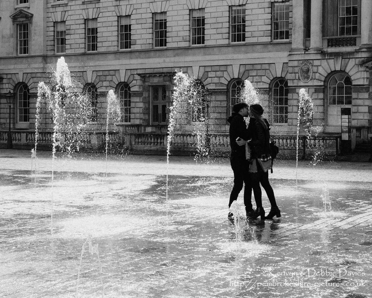 A couple looking fairly thrilled when the fountains at Somerset House came on.