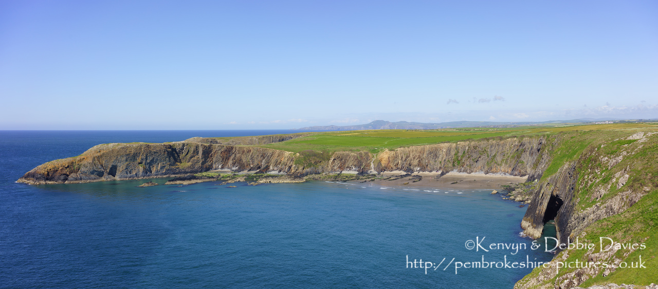 Traeth Llyfn is a small beach (it's high tide in this shot so there's not a lot to see of it) between Abereiddy and Porthgain. It is only accessible by the steps which are just visible to the centre right of the photo.