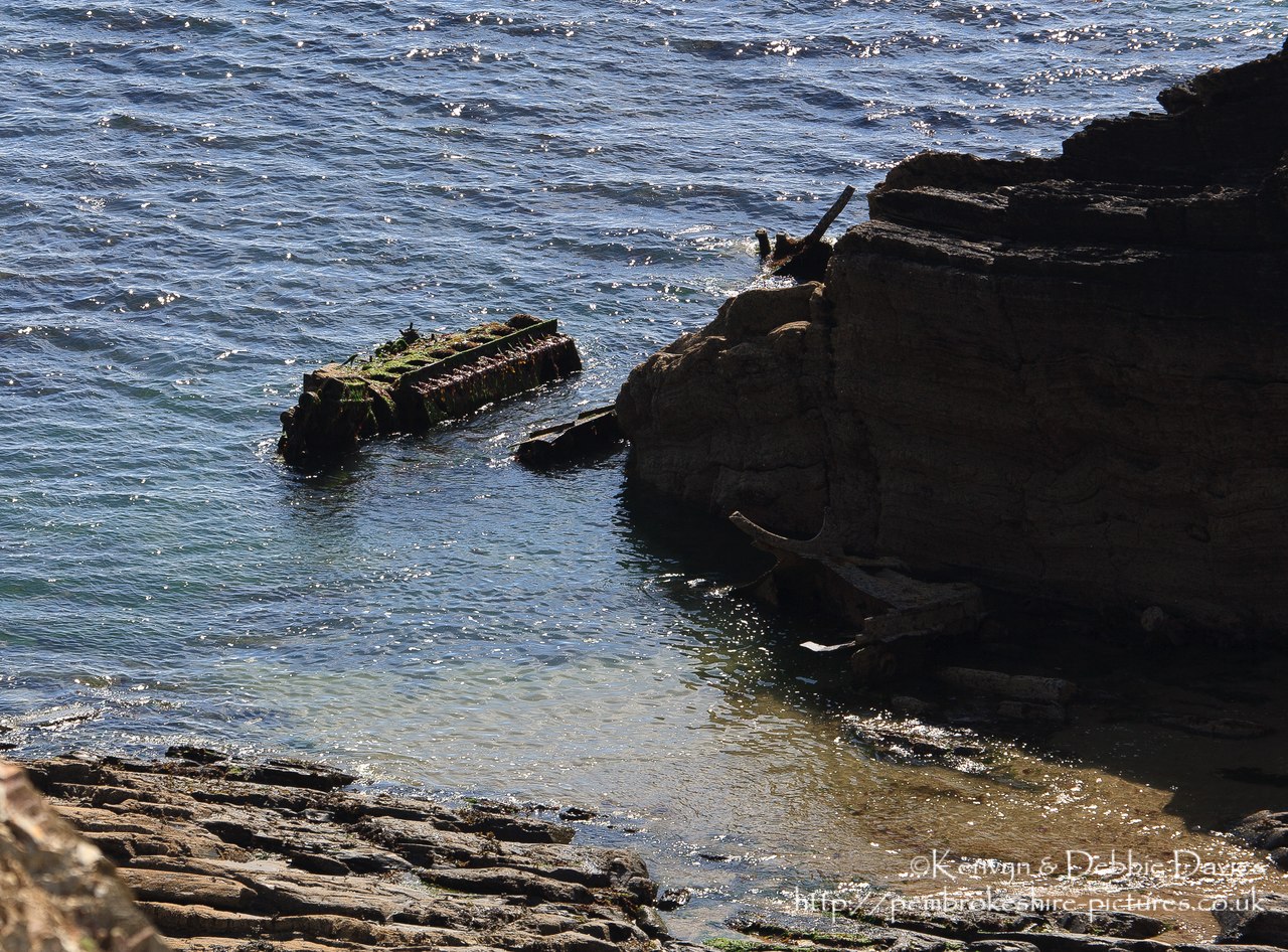 Along the coastal path a couple of miles north of Solva is the site of the wrecks of the Vernicos Alexia, Vernicos Georgios and Vernicos Barbara IV. I  1981 the Alexia was towing the Georgios and Barbara when it suffered engine problems. It's anchors failed to hold and all three tugs were swept ashore and wrecked. An engine block and a few scraps is all that remains although more can be seen at low tide.