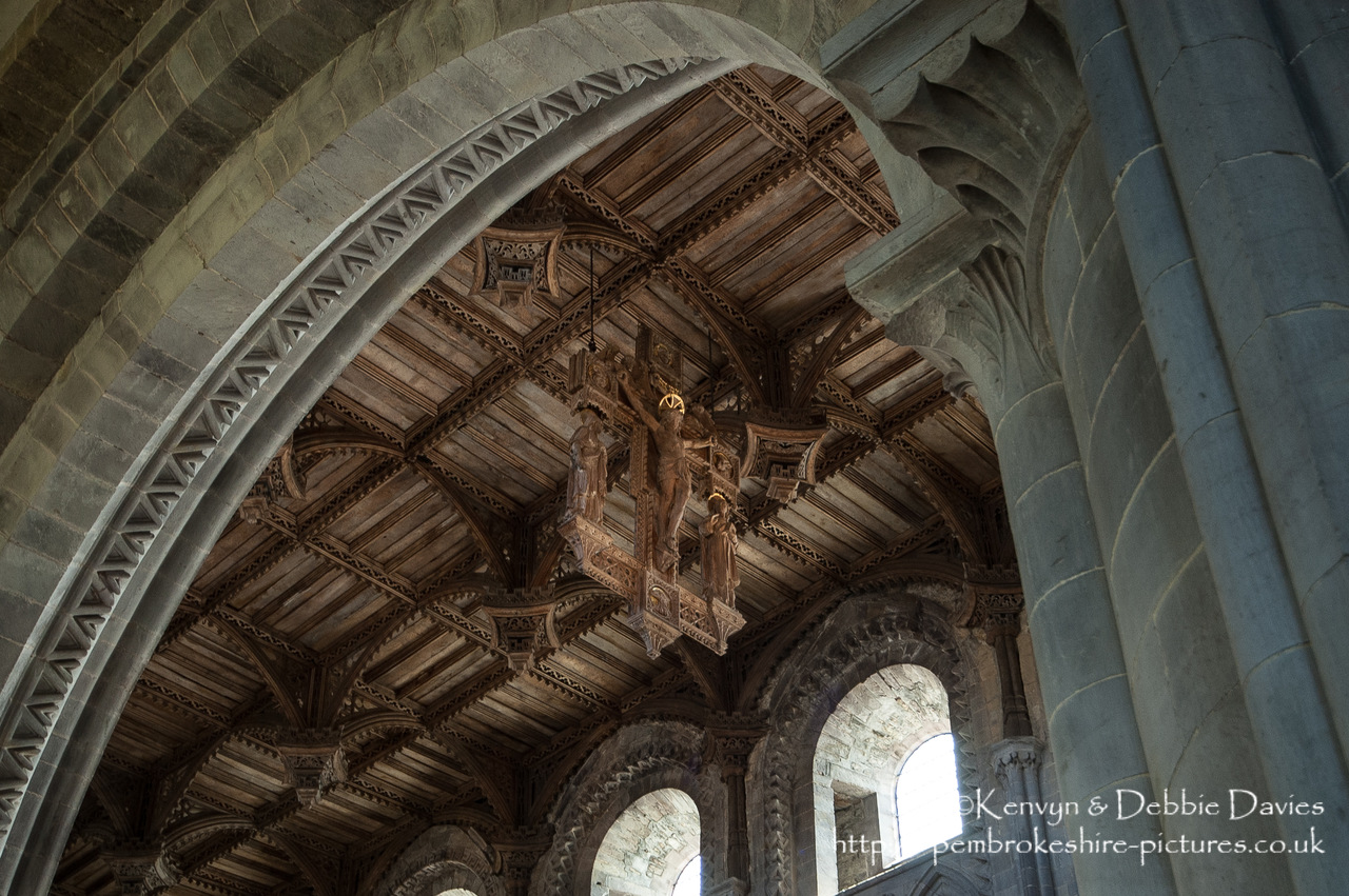 The ceiling of St Davids cathedral dates from the 16th century and is constructed in a secular type (appropriate for a great hall) with a Renaissance character. The crucifix is a 20th century replacement for the medieval original.