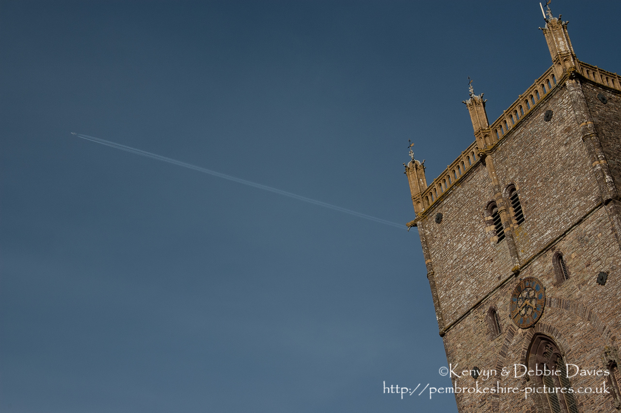 A plane passes over the 125ft high central tower of St Davids cathedral