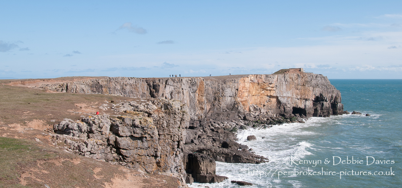 Cliffs at St Govan's Head with the Coastguard Lookout in the background.