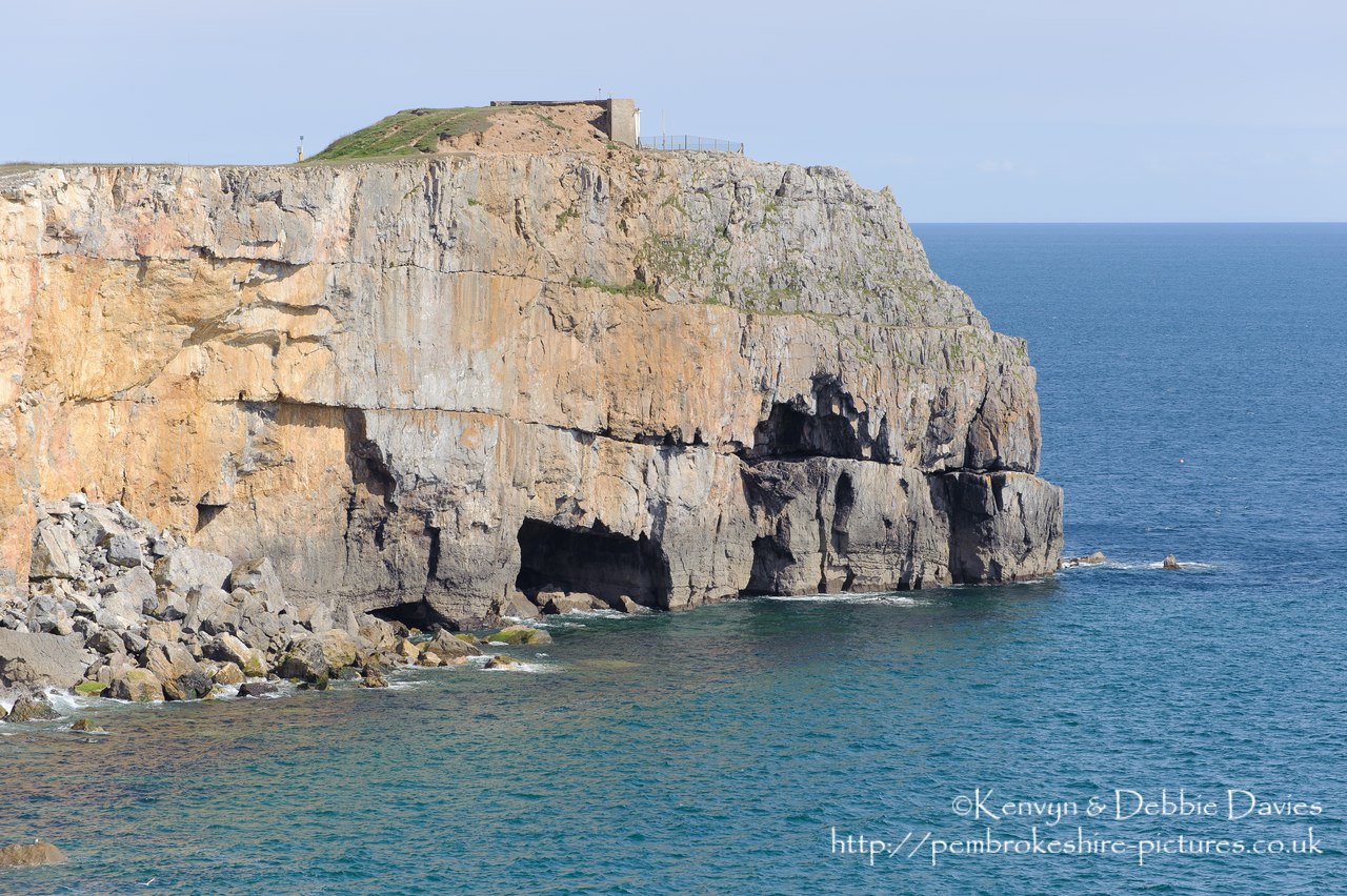 Cliffs at St Govan's Head with the Coastguard Lookout in the background.