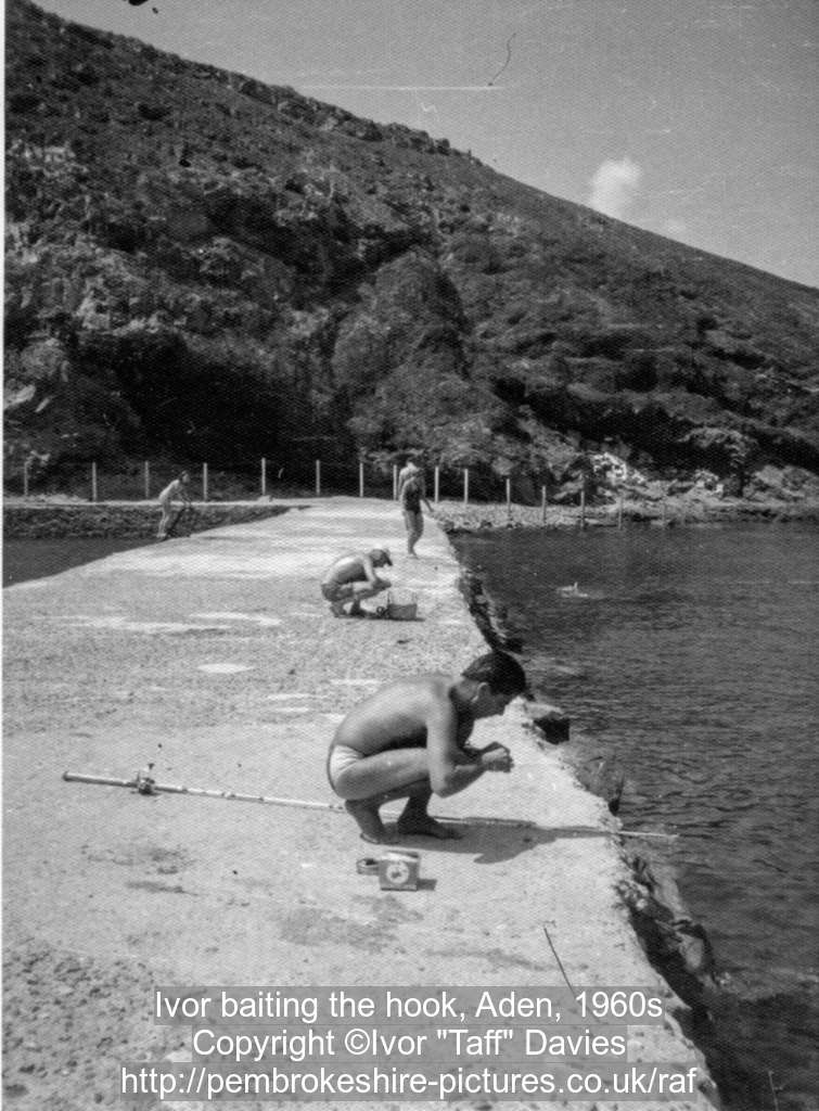 Ivor baiting the hook, Aden, 1960s