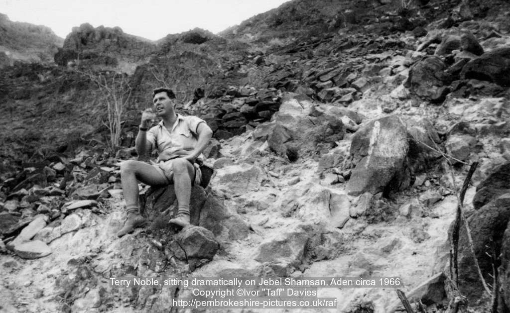 Terry Noble, sitting dramatically on Jebel Shamsan, Aden circa 1966