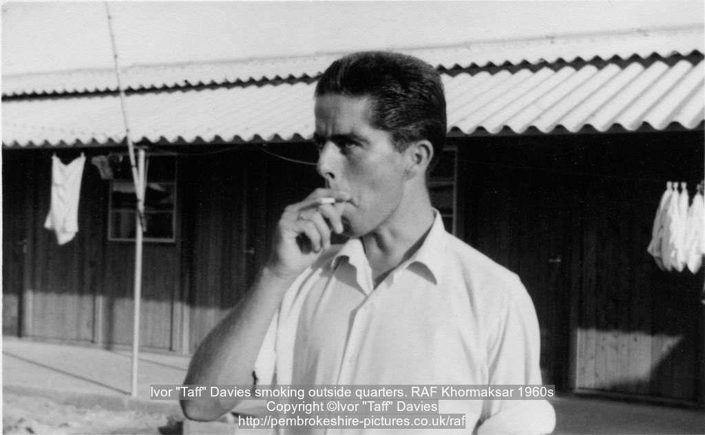 Ivor "Taff" Davies smoking outside quarters. RAF Khormaksar 1960s