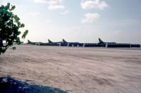 Hawker Hunter FR10s of 1417 Flight at RAF Khormaksar circa 1966   Protected by stacked 40 gallon drums of "fresh" water.
