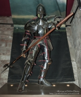 Warwick Castle is a medieval castle developed from an original built by William the Conqueror in 1068. Warwick is the county town of Warwickshire, England, situated on a bend of the River Avon. The original wooden motte-and-bailey castle was rebuilt in stone in the 12th century. During the Hundred Years War, the facade opposite the town was refortified, resulting in one of the most recognisable examples of 14th century military architecture. It was used as a stronghold until the early 17th century, when it was granted to Sir Fulke Greville by James I in 1604. Sir Fulke Greville converted it to a country house. It was owned by the Greville family, who became earls of Warwick in 1759, until 1978 when it was bought by the Tussauds Group.<br/><br/>From Wikipedia ([http://en.wikipedia.org/wiki/Warwick_Castle]).